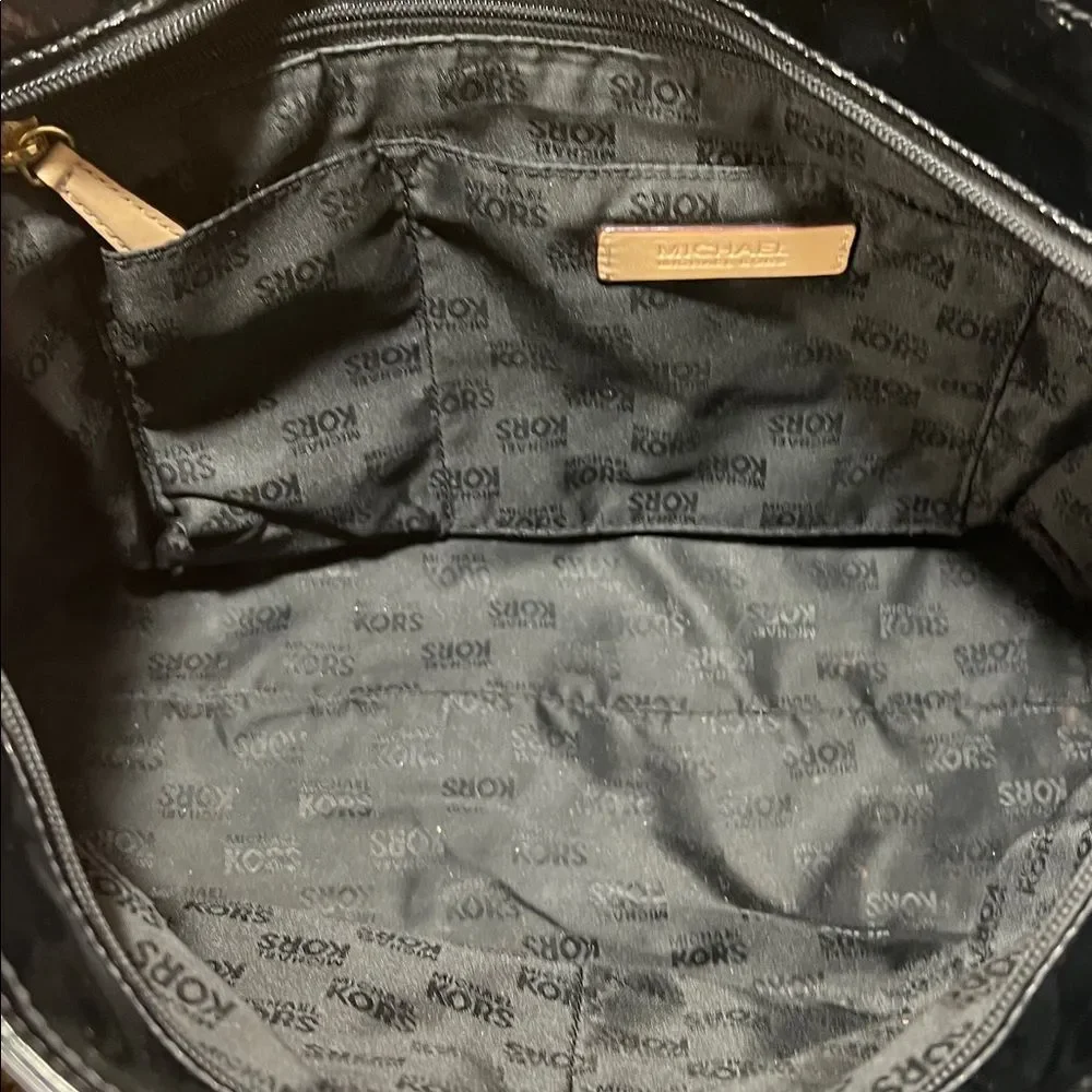 Michael Kors Jet Set Chain Tote in black patent leather with gold hardware.